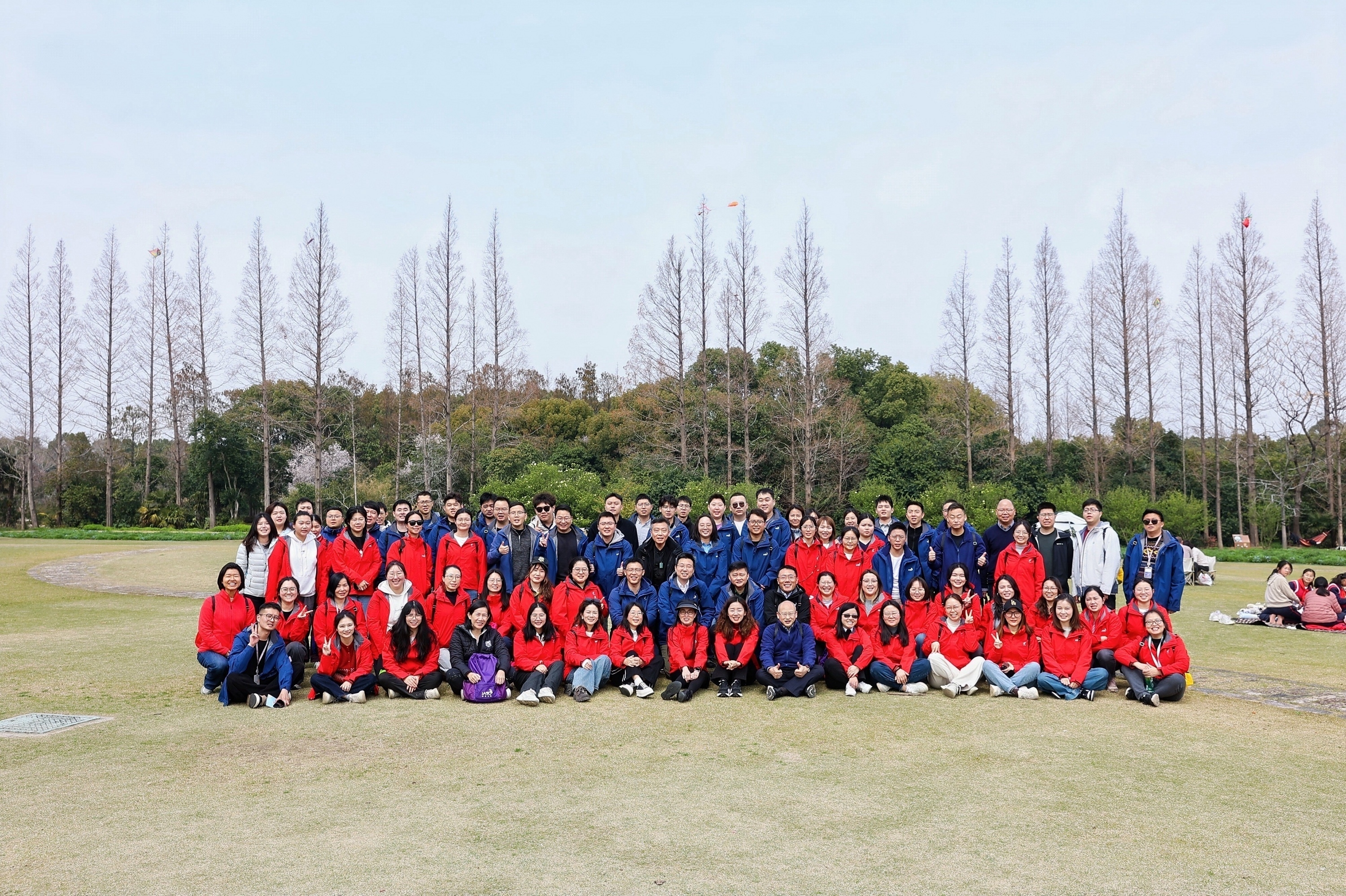 IASO team gathered for a group photo in the park